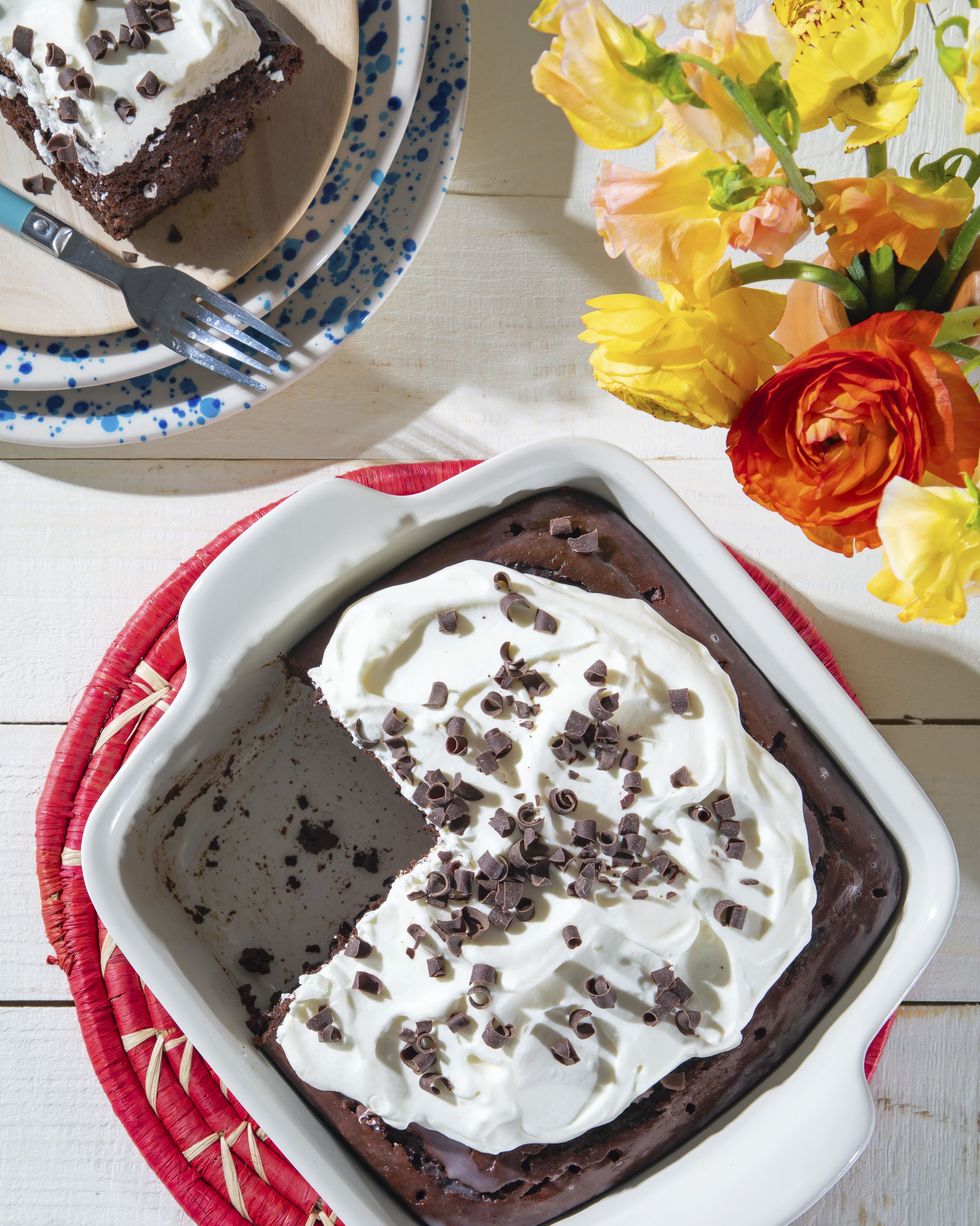 chocolate tres leches cake in a white square baking dish