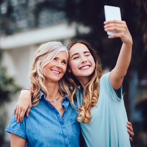 mother and daughter taking selfie