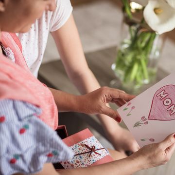 family reading mothers day card together