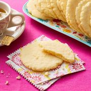 rees sugar cookies with tea on pink surface