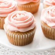 pink rose cupcakes on white plate