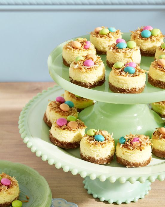 mini bird's nest key lime cheesecakes with toasted coconut and pastel candies on top