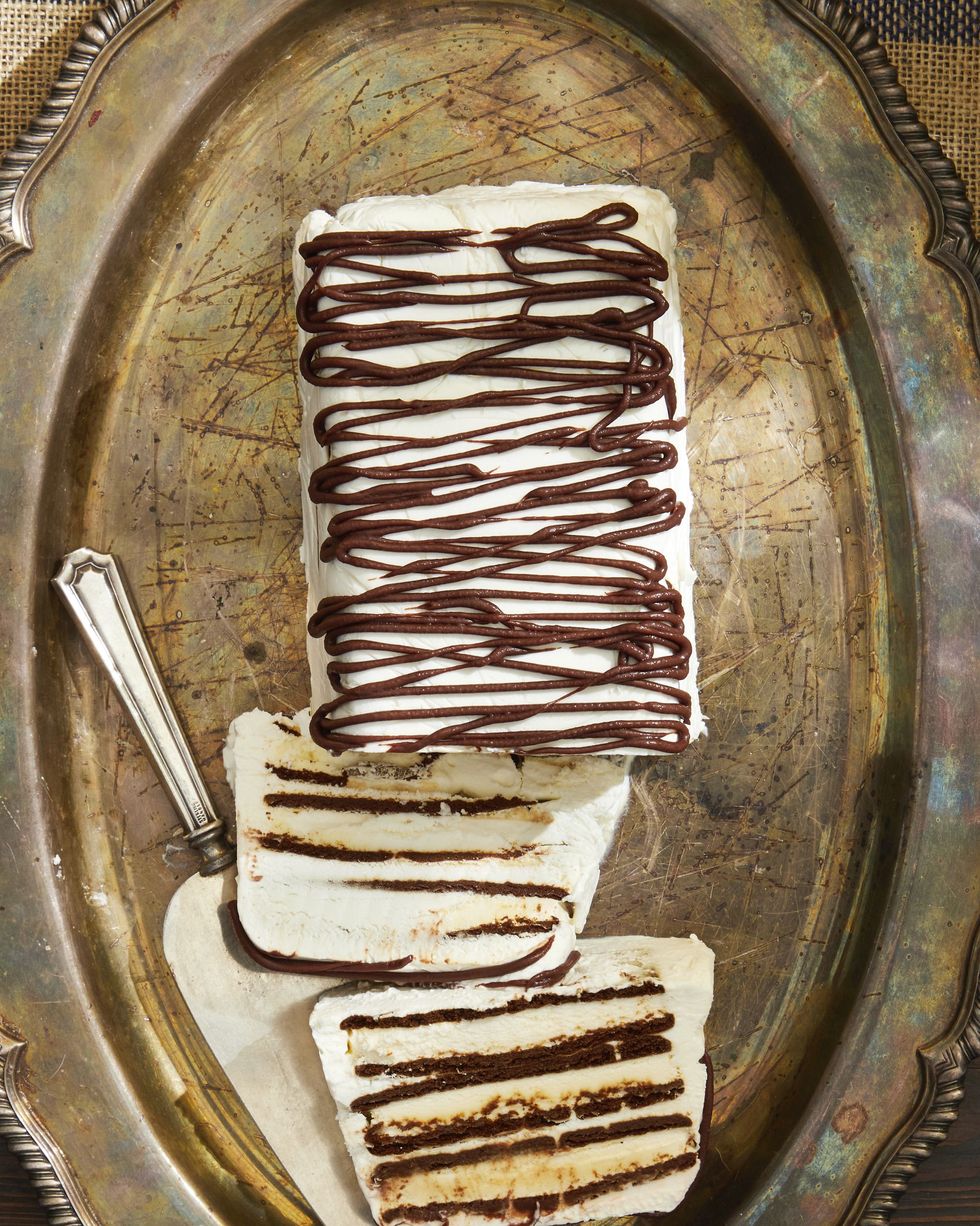 zebra semifreddo on a metal serving tray with a cake server