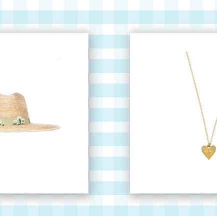 straw hat with ribbon around base with embroidered daisies and gold necklace with gold heart charm that says mama