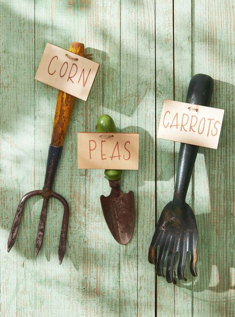vintage garden tools with tags to be used a garden markers