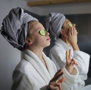 Mother's Day Spa Specials happy woman and daughter with bathrobe, doing daily routine
