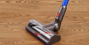 motorized head of modern vacuum cleaner on a wooden floor