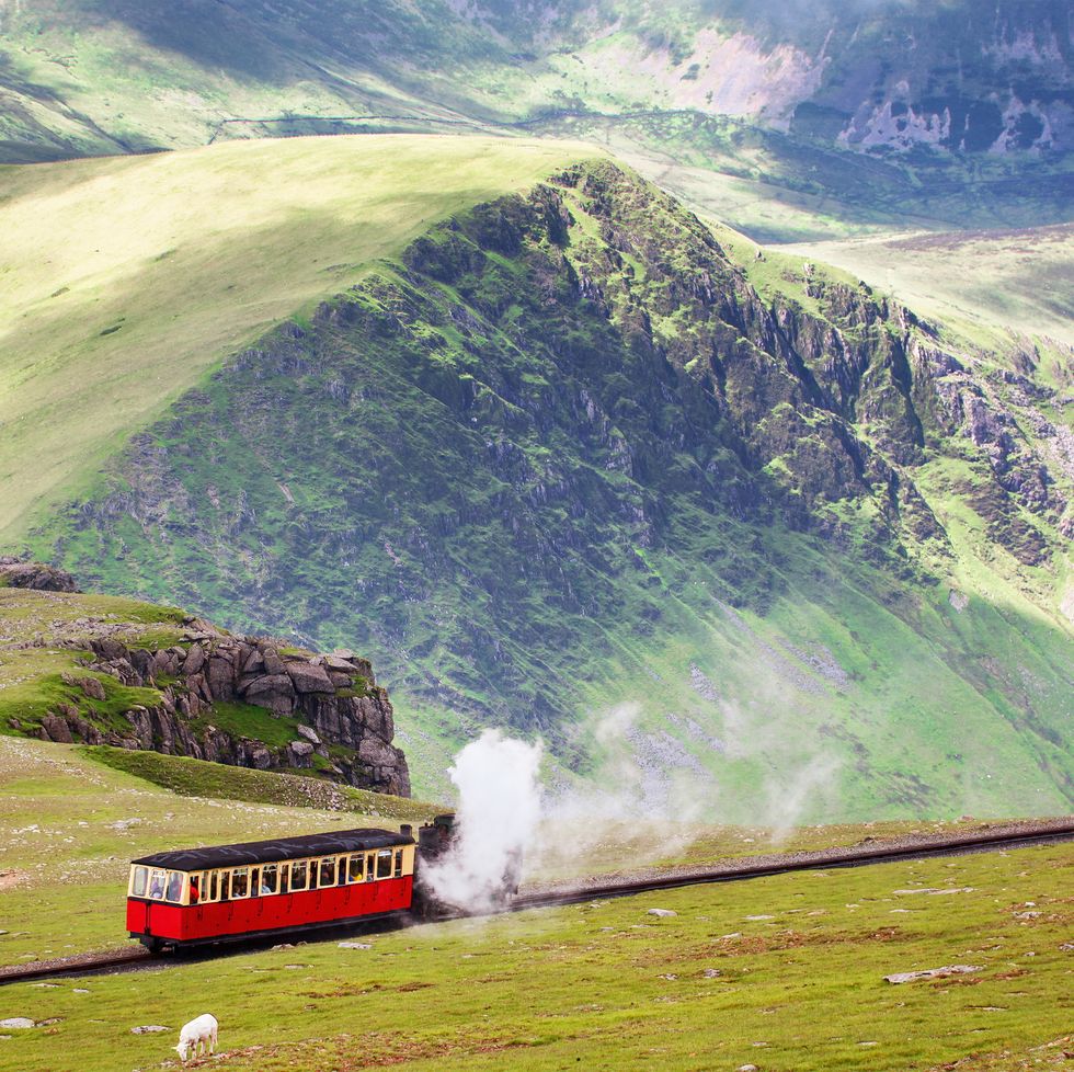 mountain railway, snowdonia, north wales the steam train runs from the town of llanberis in the valley to the summit of mount snowden rural landscape in spring