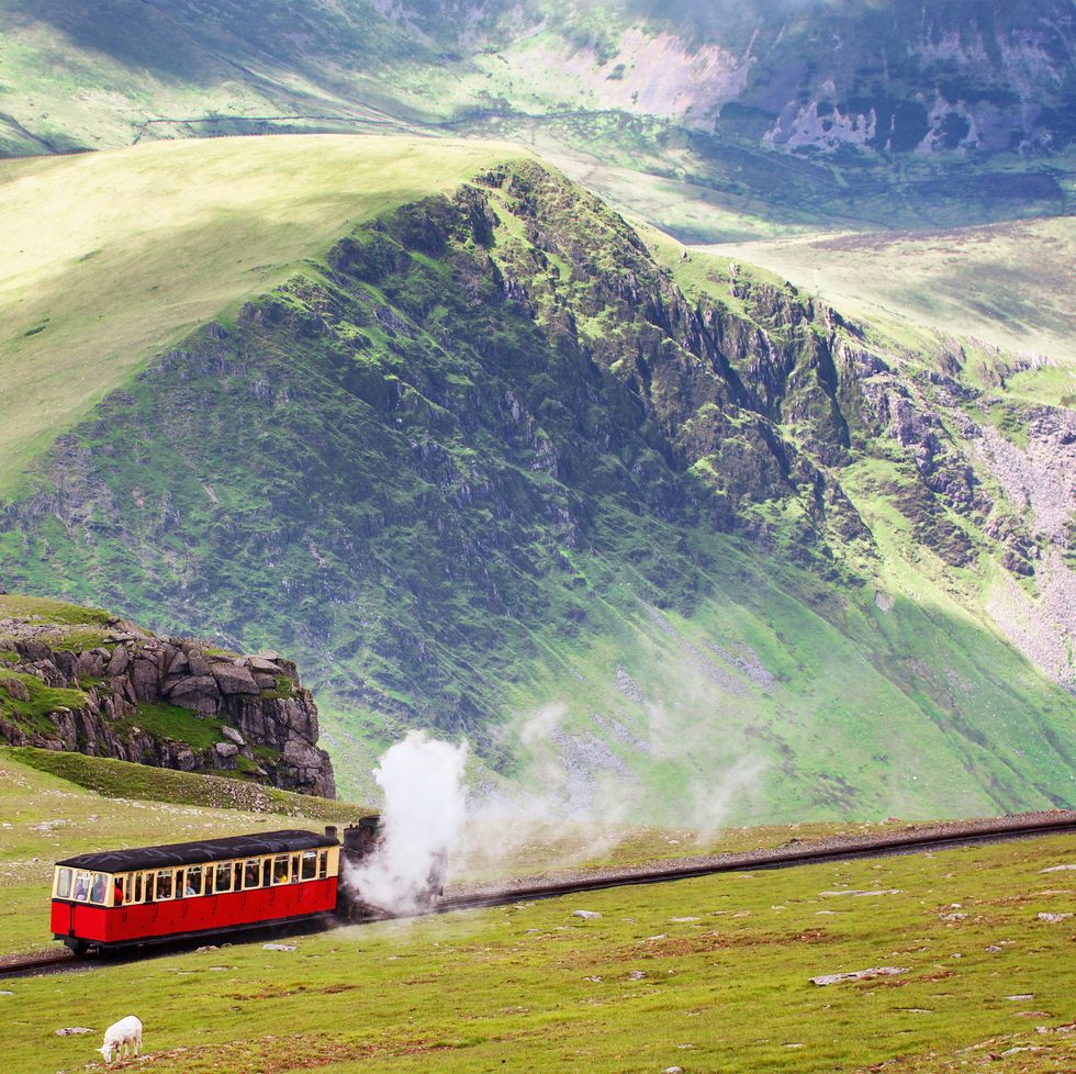 mountain railway, snowdonia, north wales the steam train runs from the town of llanberis in the valley to the summit of mount snowden rural landscape in spring