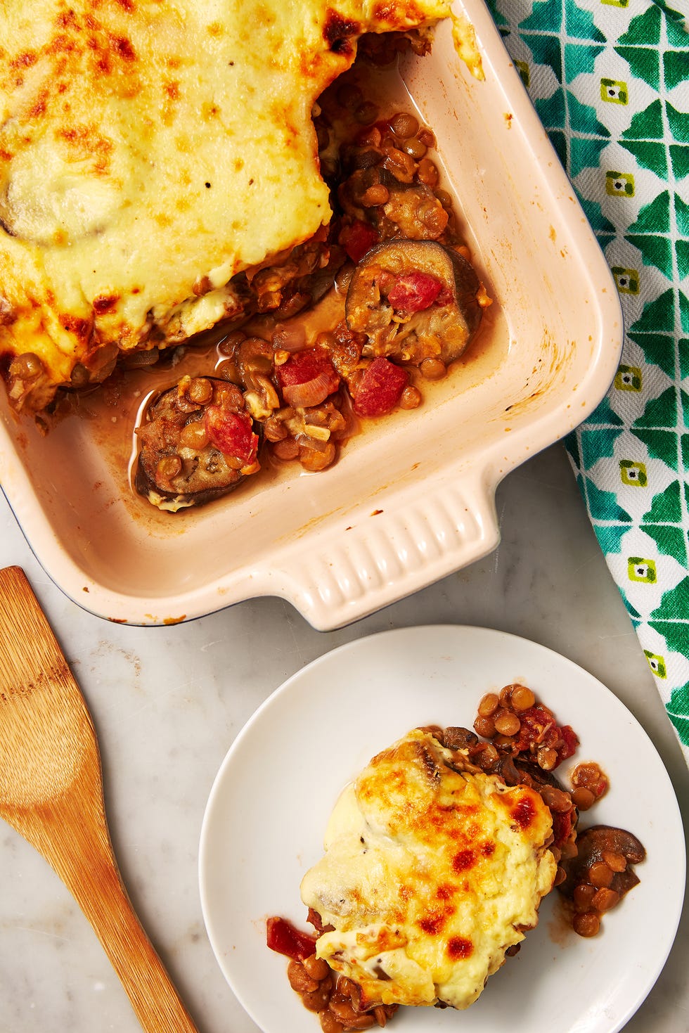 slice of vegetarian eggplant moussaka on a white plate
