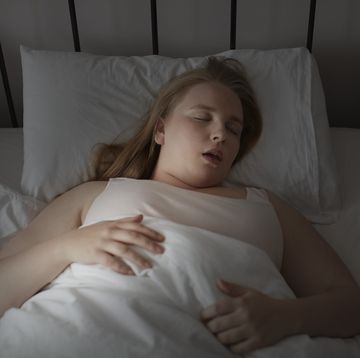 young woman asleep with her mouth wide open