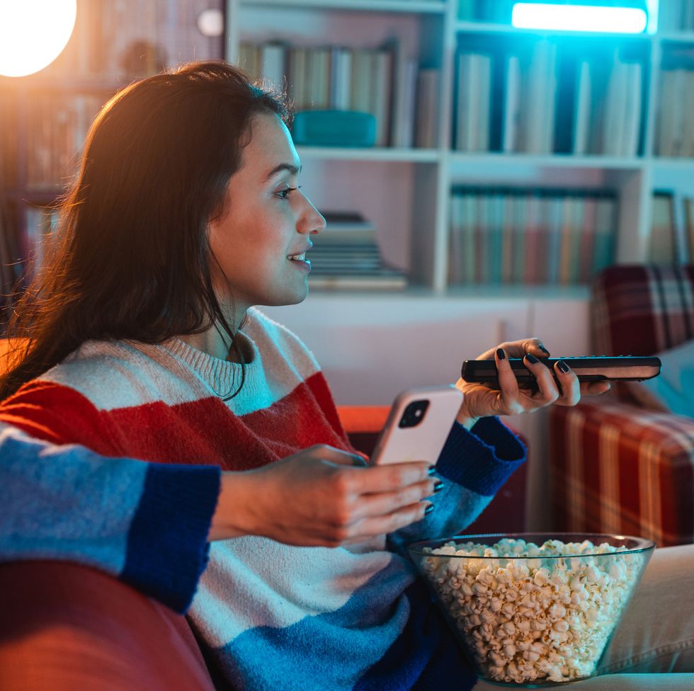 woman has movie night at home