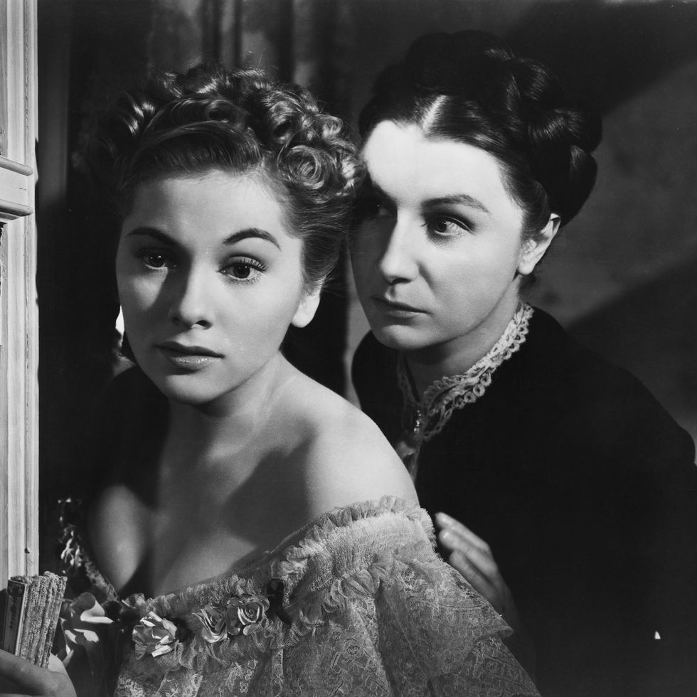 1940: movie still from the 1940 film, "rebecca." in this scene, joan fontaine and judith anderson are shown looking out of window. (photo by �� john springer collection/corbis/corbis via getty images)