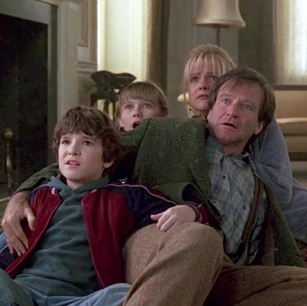 A family looks surprised in a scene from Jumanji a family looks surprised in a scene from jumanji