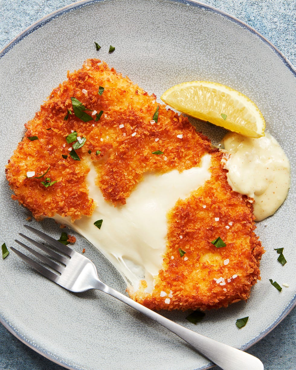 mozzarella schnitzel with mustard cream sauce and lemon