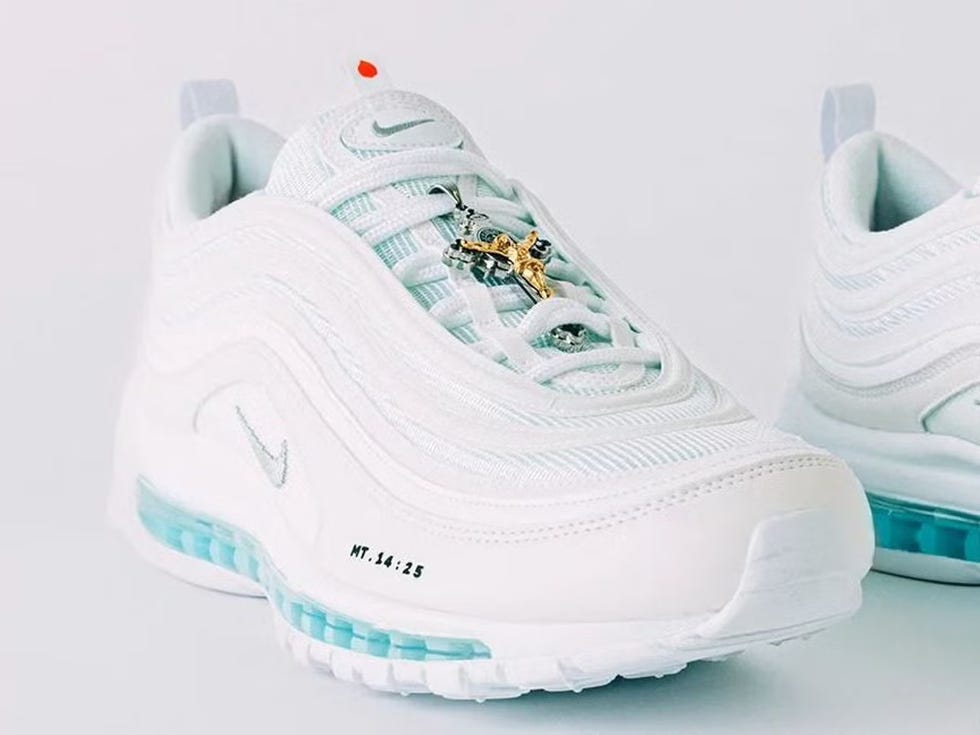 stylish white nike air max 97 sneakers featuring a gold cross pendant