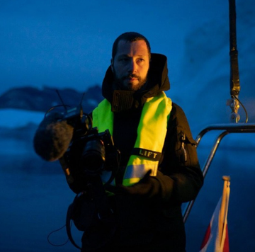 a person holding a camera a person holding a camera