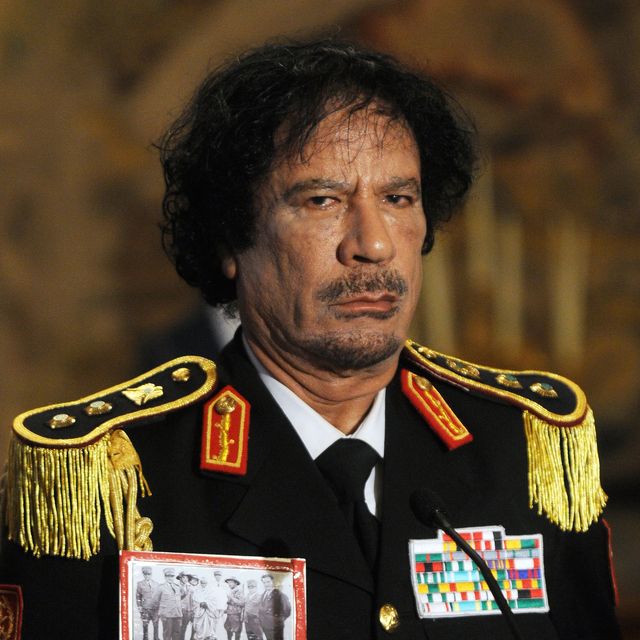 Libya's Muammar Gadhafi in first visit to ex-colonial power Italy, in Rome, Italy on June 10, 2009. ITALY - JUNE 10: At the Quirinale Palace , Libyan leader Moammar Gadhafi has hailed a 'new era' in relations with Italy during his first visit to his country's former colonial ruler. When he arrived in Rome he brazenly wore a picture of a legendary Lybian resistance hero Omar Al-Mukhtar in chains alongside his Italian captors and hanged in 1931. (Photo by Eric VANDEVILLE/Gamma-Rapho via Getty Images)