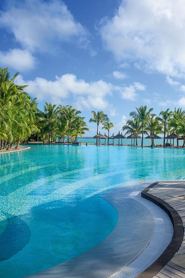 Swimming pool, Tropics, Vacation, Sky, Water, Resort, Caribbean, Natural landscape, Tree, Sea, 
