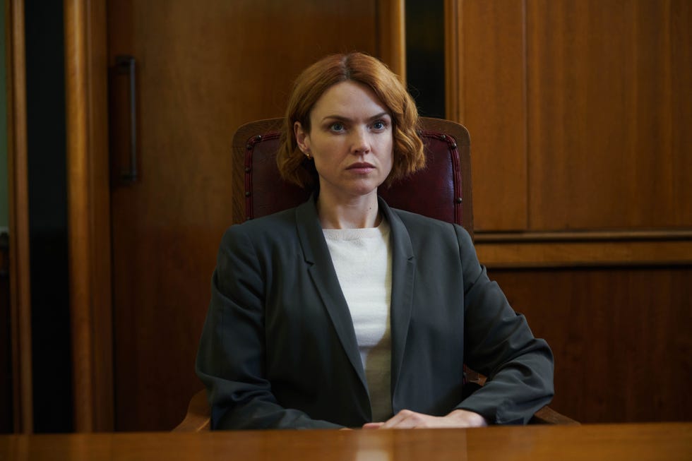 a seated individual in a formal setting
