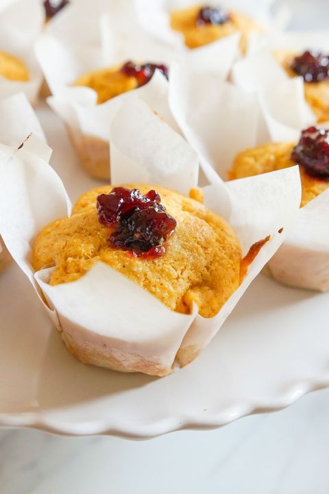 cornmeal muffins with blackberry jam in paper liners