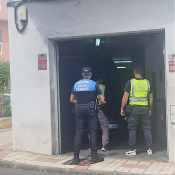 a group of police officers entering a building