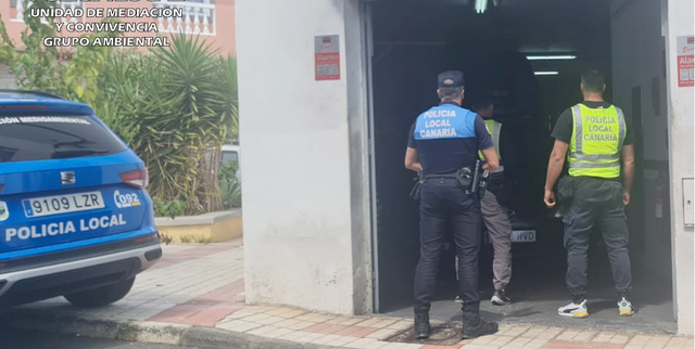 a group of police officers entering a building