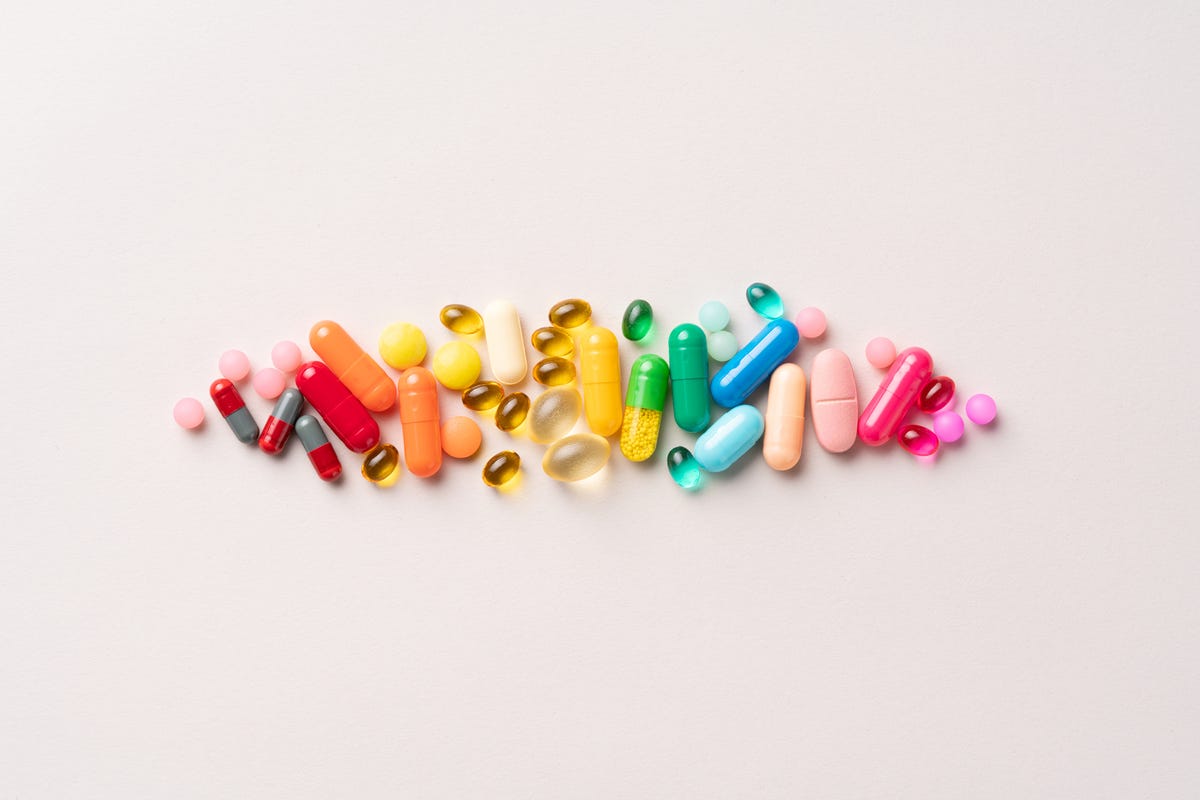 multi colored medical pills organized in a row royalty free image