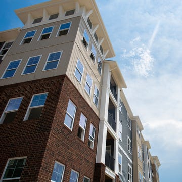 modern building under construction, with dark space for light text