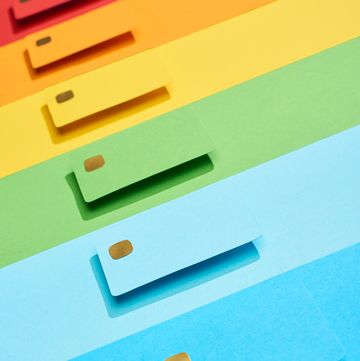 multicolored empty credit cards on rainbow background