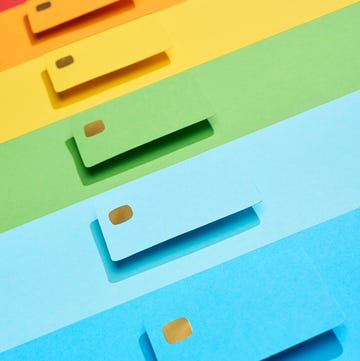multicolored empty credit cards on rainbow background