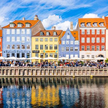 multicolored houses along the canal in nyhavn harbor, copenhagen, denmark