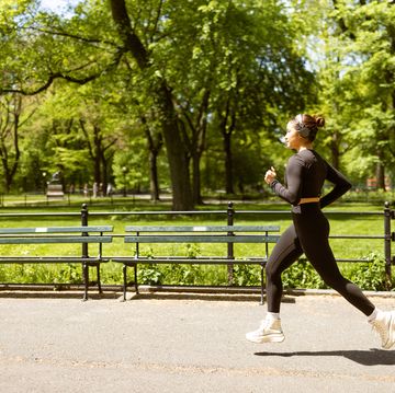 multiracial girl jogging in central park