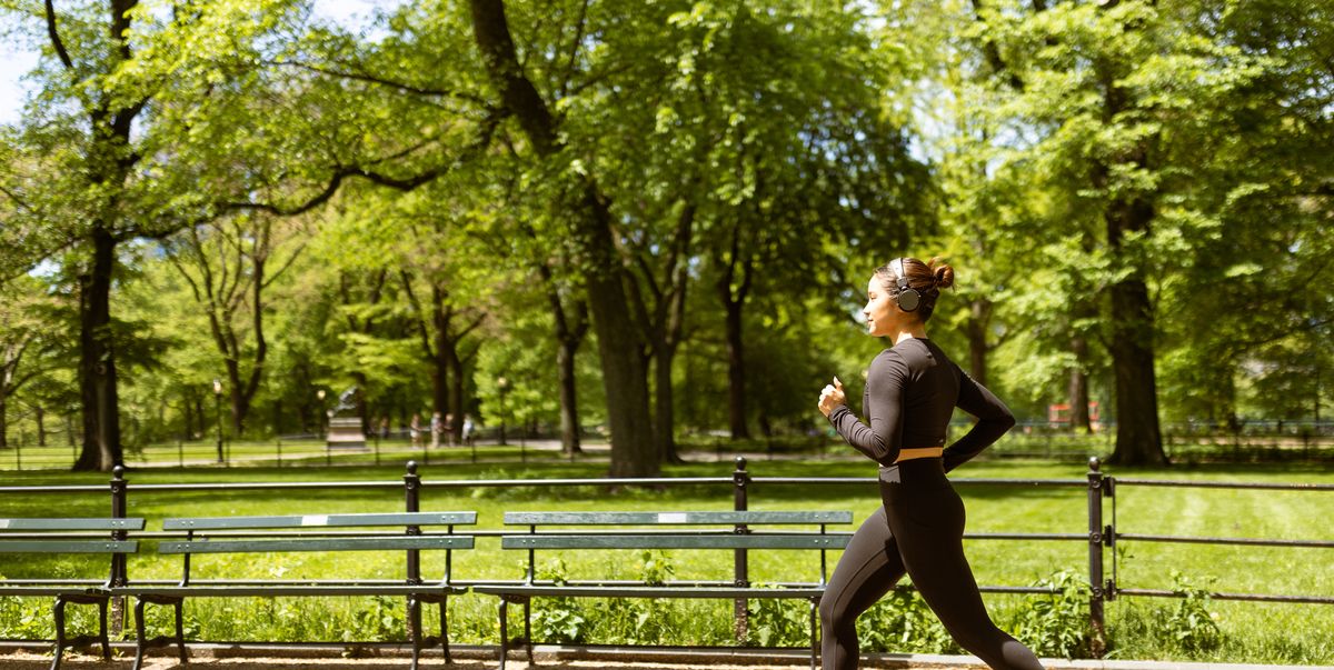 multiracial girl jogging in central park