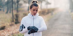 girl checking heart rate on smartwatch after jogging