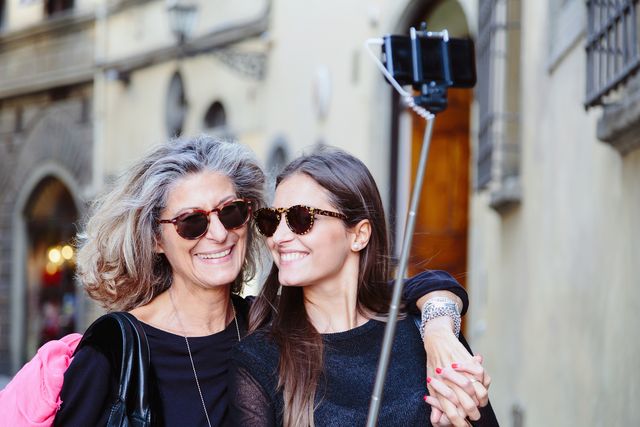 Mum and daughter taking photo with selfie stick