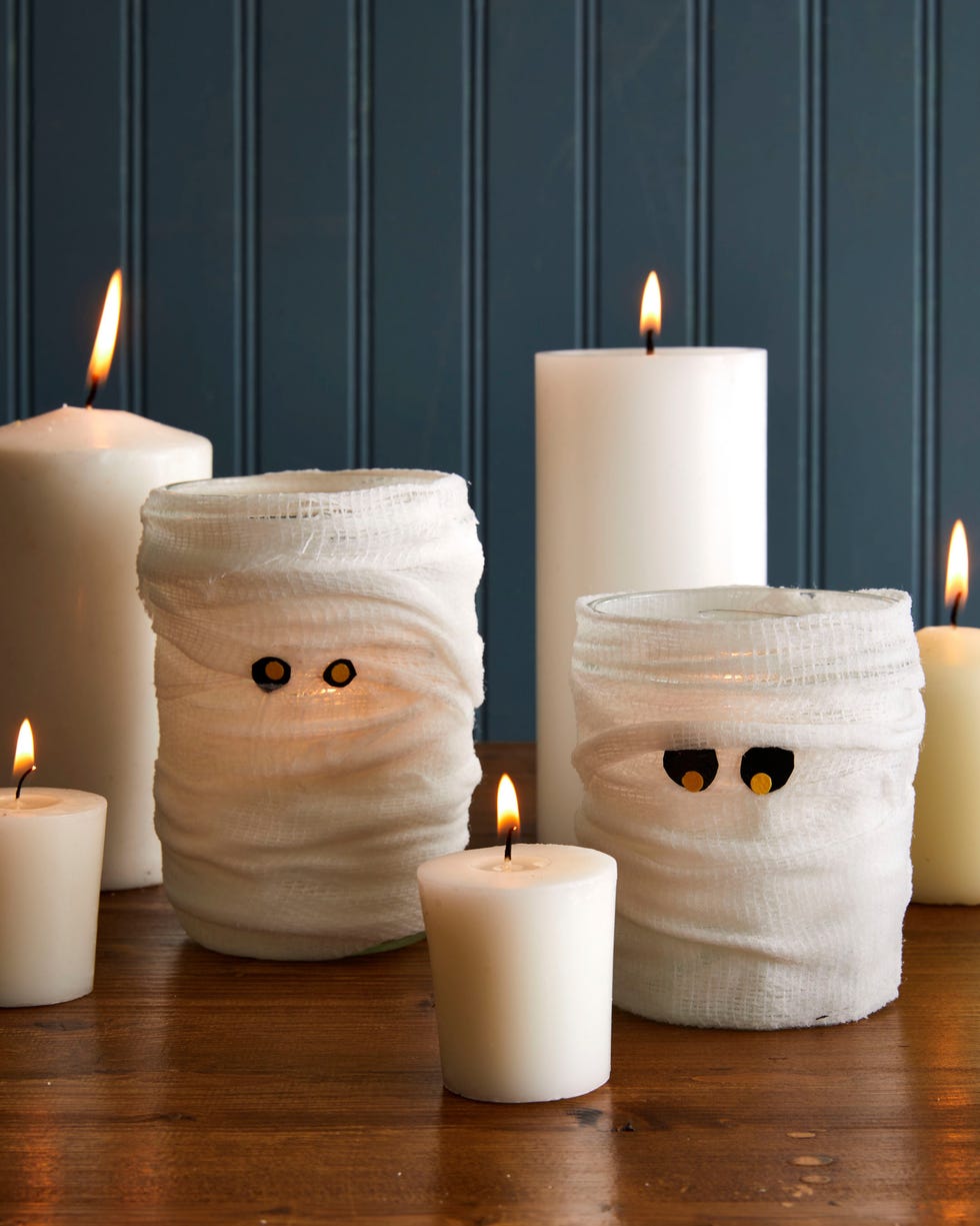 wide mouth mason jars wrapped in gauze with felt eyes so they look like mummies wide mouth mason jars wrapped in gauze with felt eyes so they look like mummies