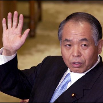 muneo suzuki, scandal lawmaker of ldp gave sworn tenstimony in diet in tokyo, japan on march 11, 2002