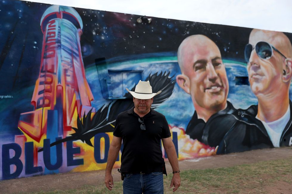 van horn, texas   july 19 david morales stands near a mural on the side of his building he had painted to honor jeff bezos as the billionaire plans to launch his blue origin rocket from a launchpad in west texas on july 19, 2021 in van horn, texas mr bezos is scheduled to lift off from the launch pad at 8 am local time on tuesday in the blue origin’s suborbital new shepard rocket in the first human spaceflight for his company mr bezos is to be joined by his brother mark bezos, 18 year old oliver daemen, and 82 year old wally funk photo by joe raedlegetty images