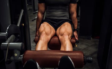 muscular man doing legs in the gym