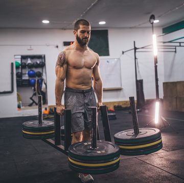 Muscular man working out in gym