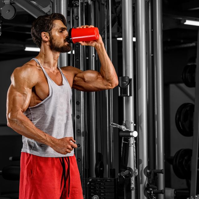 Muscular Men Drink His Nutritional Supplement