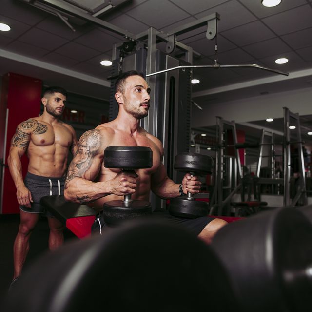 muscular men training in gym