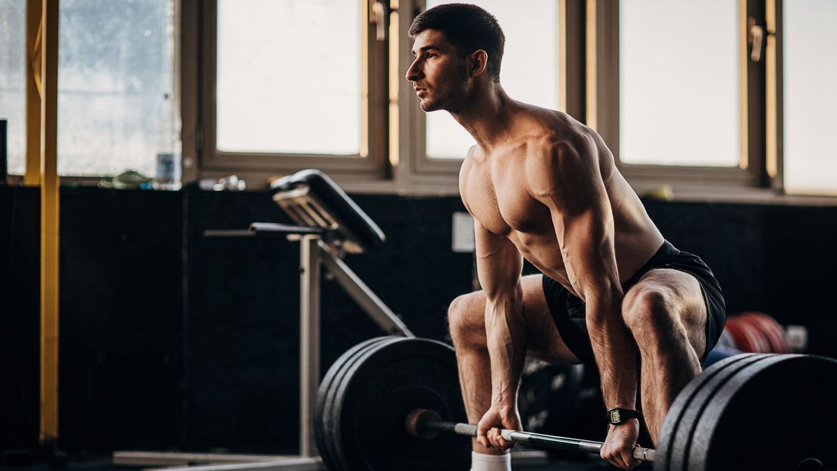Premium Photo  Male athlete with muscular build does workout