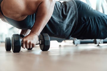 muscular young man training at gym