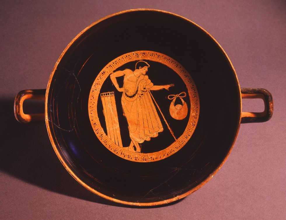 greek red figure pottery representing a young man at the museum of cycladic art athens