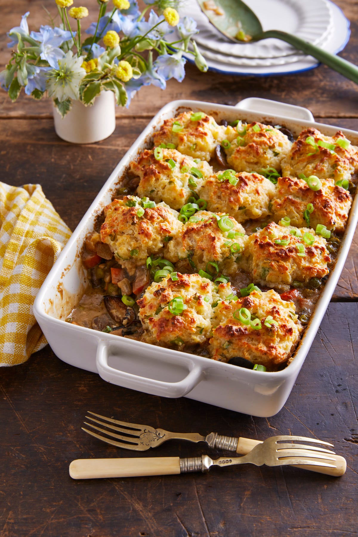 a bowl of mushroom pot pie with scallion drop biscuits