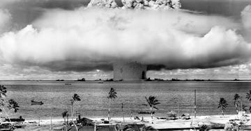 usamarshall islands mushroom shaped cloud and water column from the underwater baker nuclear explosion of july 25, 1946 photo taken from a tower on bikini island, 35 miles 56 km distant