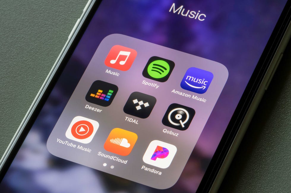 a photo showing a folder on an iphone with multiple music streaming service apps