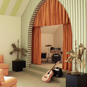 music room with orange curtains